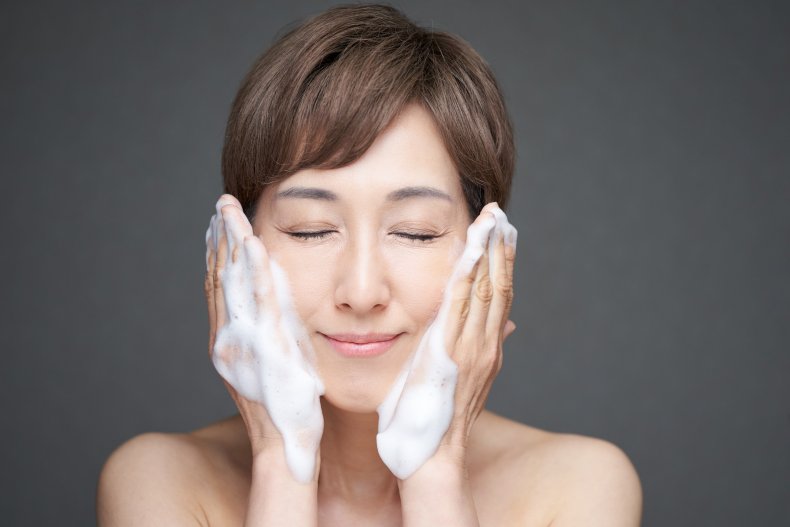 woman-washing-her-face-soap